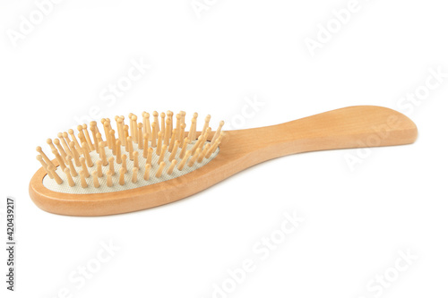 Wooden comb brush isolated on white background  clipping path.