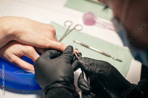 manicurist makes nails beautiful and healthy