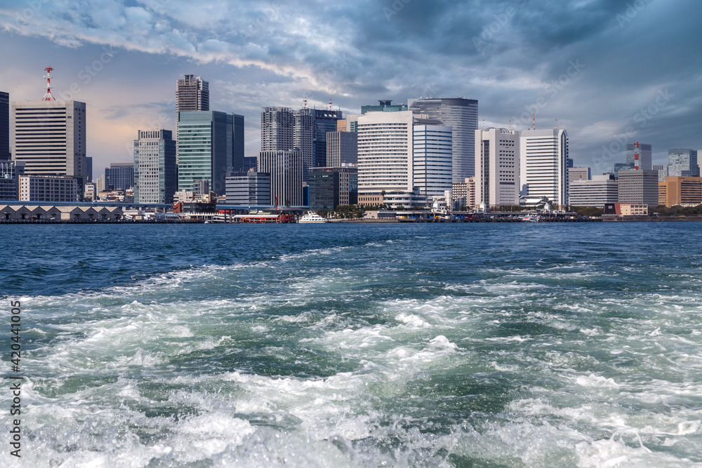 Cityscape of Tokyo Bay area as seen from the water. Tokyo, Japan.
