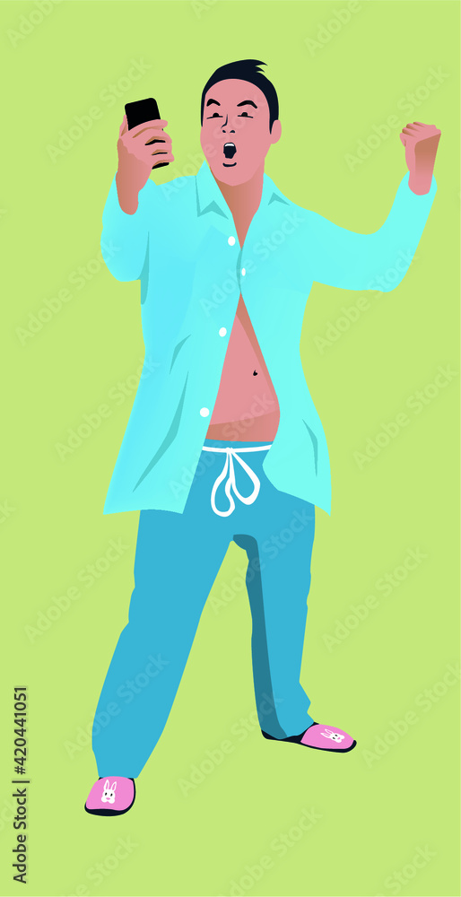Fototapeta premium Middle aged man celebrating win on his phone while in his pajamas