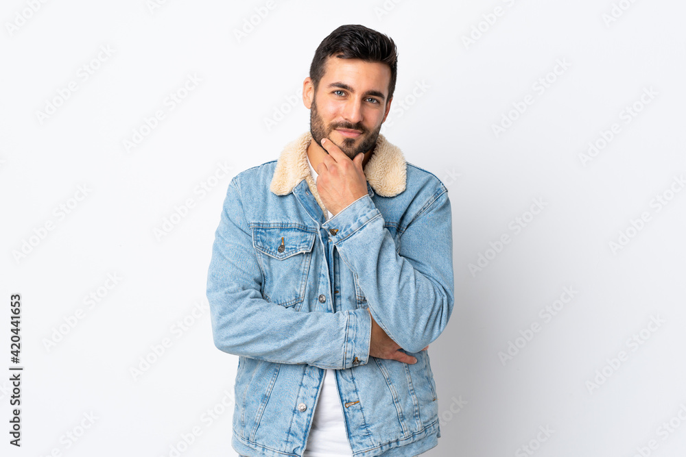 Young handsome man with beard isolated on white background thinking Young handsome man with beard isolated on white background thinking