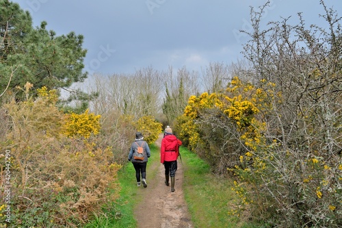 Retired Hikers on the path at Ploumanach in Brittany. France © aquaphoto