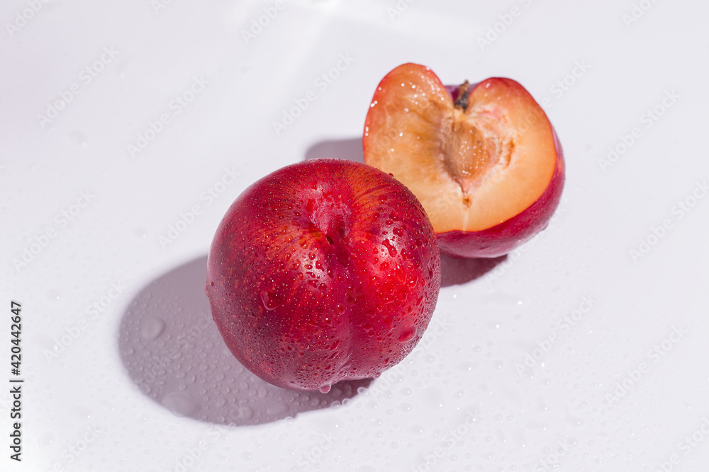 Fresh plums on white background Fresh plums on white background
