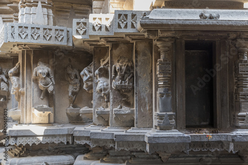 old hindu temple with head removed statues and one gate photo