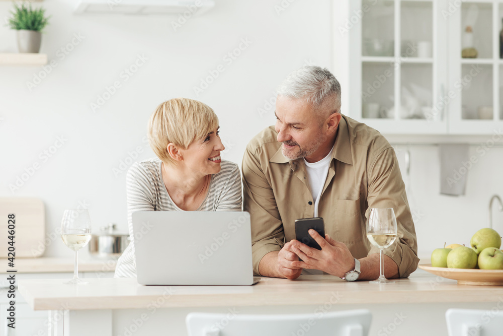 Middle aged couple on free time or weekend with tech and social media Middle aged couple on free time or weekend with tech and social media