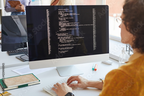 Software Engineer Writing Code at Computer photo