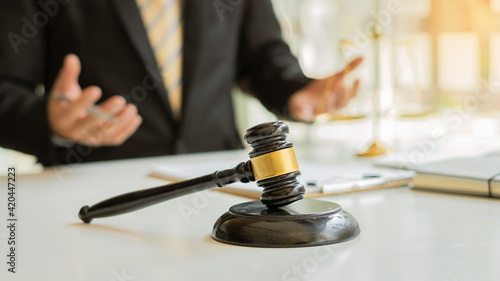 Wallpaper Mural Male attorney advisor or judge advisor concept, having team meetings with clients, legal concepts and hammer attorneys with fair scales on desks in the office. Torontodigital.ca