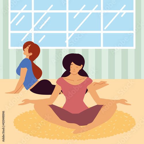women practicing yoga