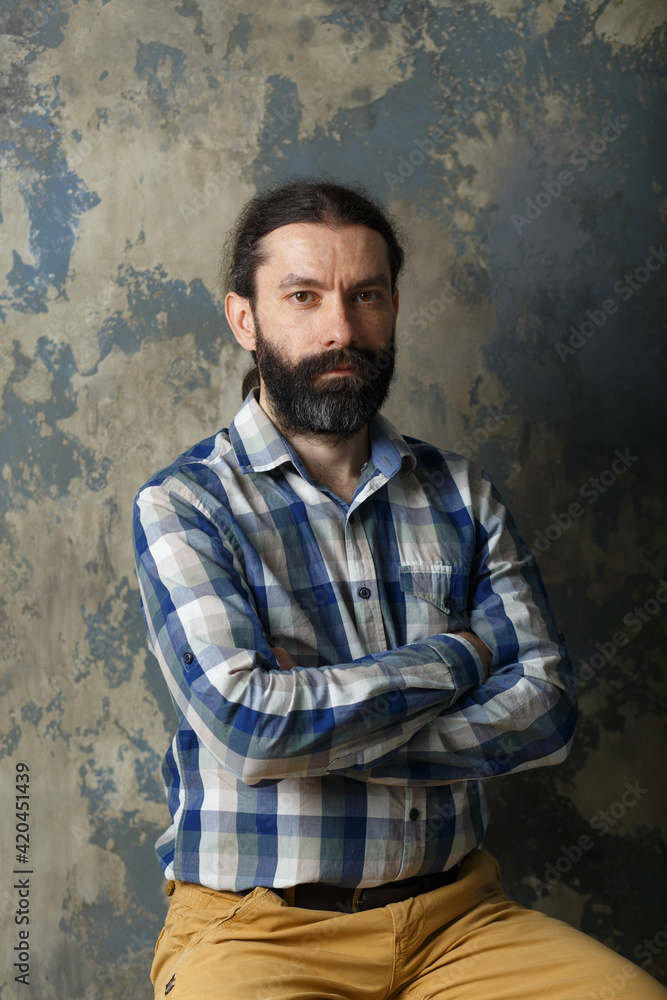 Portrait of a pleasant young man with a beard and mustache Portrait of a pleasant young man with a beard and mustache