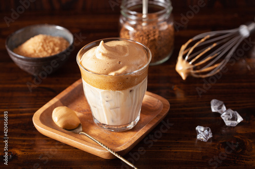 dalgona coffee in glass. trendy Instant coffee whipped with sugar and hot water photo