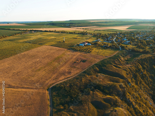 wheat fields and village in sunlight