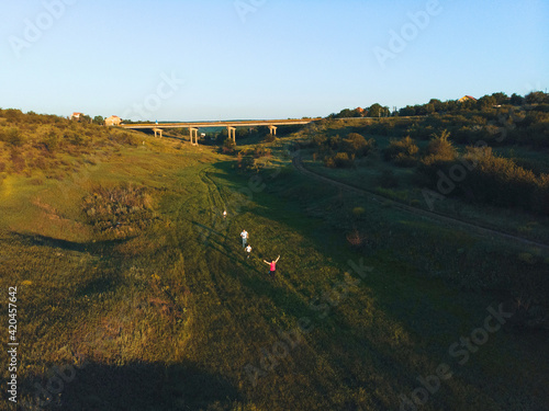 happy family running on green meadow