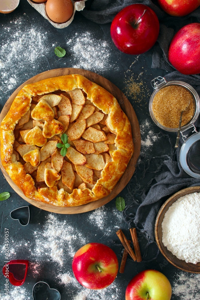 Homemade apple cake on dark background. Top view with copy space. Homemade apple cake on dark background. Top view with copy space.