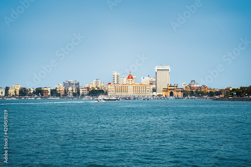 view of Mumbai city from sea, Beautiful view of the Gateway of India and famous luxury hotel and city buildings cityscape © GEMINI