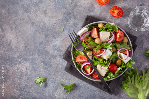 tomato salad with brie cheese olives onion lettuce