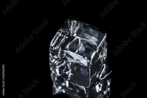 Square ice cubes on a black background