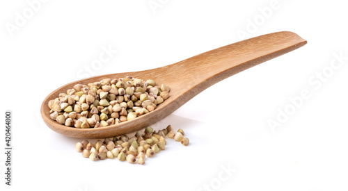Buckwheat in wood spoon on the white background