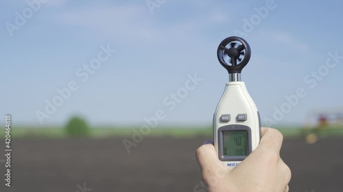 anemometer in the hand of man, which measures wind speed