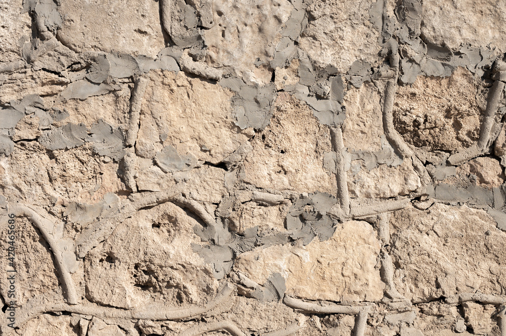 Decorative wall made of natural stone of various shapes and sizes. Interior background Decorative wall made of natural stone of various shapes and sizes. Interior background
