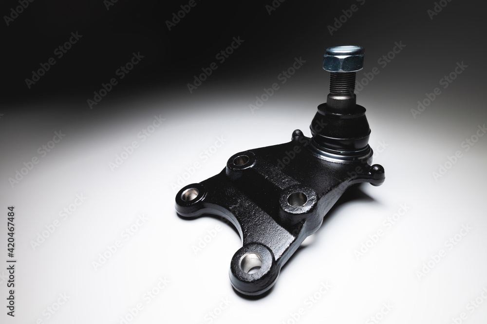 New ball joint of a passenger car on a gray background. Spare parts