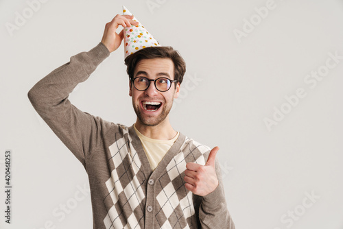 Schilderij op canvas Cheerful young man geek celebrating birthday