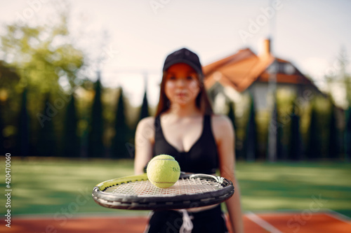 Beautiful and stylish girl on the tennis court © prostooleh