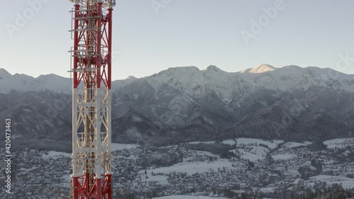 Lattice Tower Of RTON Gubalowka Transmitter Standing On The Gubalowka Mountain Overlooking Vast Wintry Landscape Of Zakopane In Poland. aerial drone photo