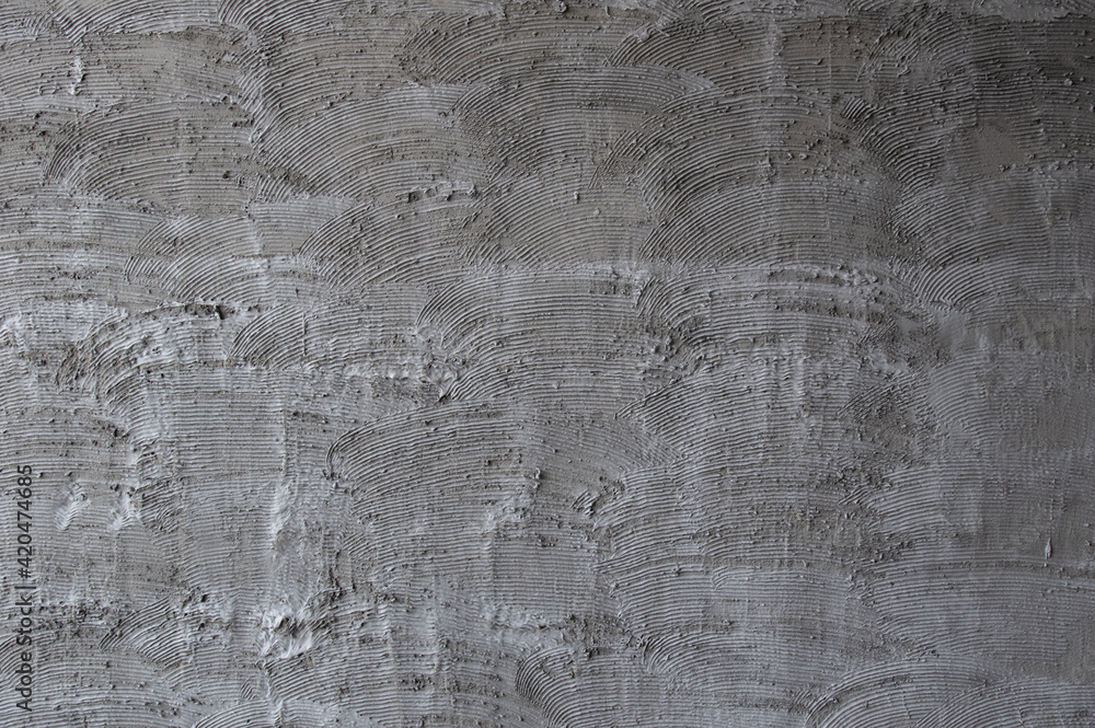 Obraz premium Texture of fresh concrete wall on construction site, fresh plastered cement wall.Gray blank cement textured or plaster wall abstract art pattern texture for background creative work with copy space