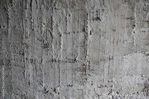Texture of fresh concrete wall on construction site, fresh plastered cement wall.Gray blank cement textured or plaster wall abstract art pattern texture for background creative work with copy space