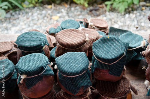 Clay jars with honey. Counter with ceramic dishes. Abkhazia