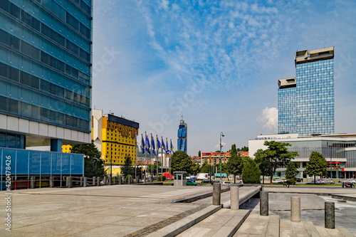 View of the urban districts of Sarajevo, from the Parliament building. The Holiday Hotel, flags, the Avaz Twist tower and the UNIS towers .