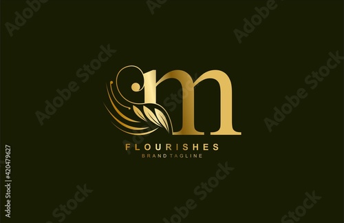 lowercase letter m linked beauty flourish golden color logo design