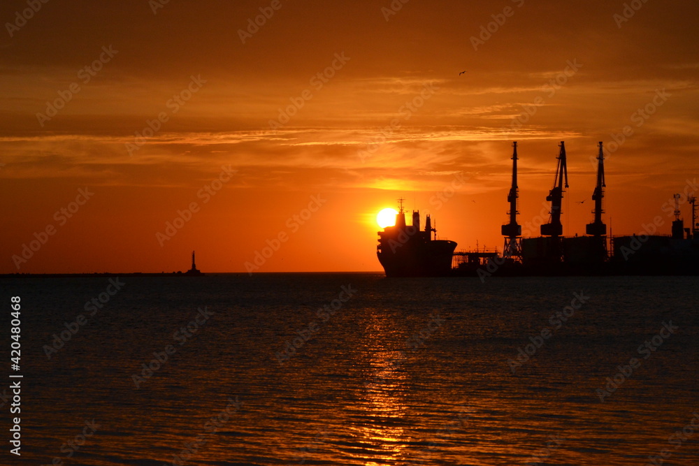 silhouette of a ship at sunset