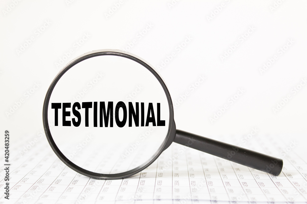 words TESTIMONIAL in a magnifying glass on a white background. business concept words TESTIMONIAL in a magnifying glass on a white background. business concept