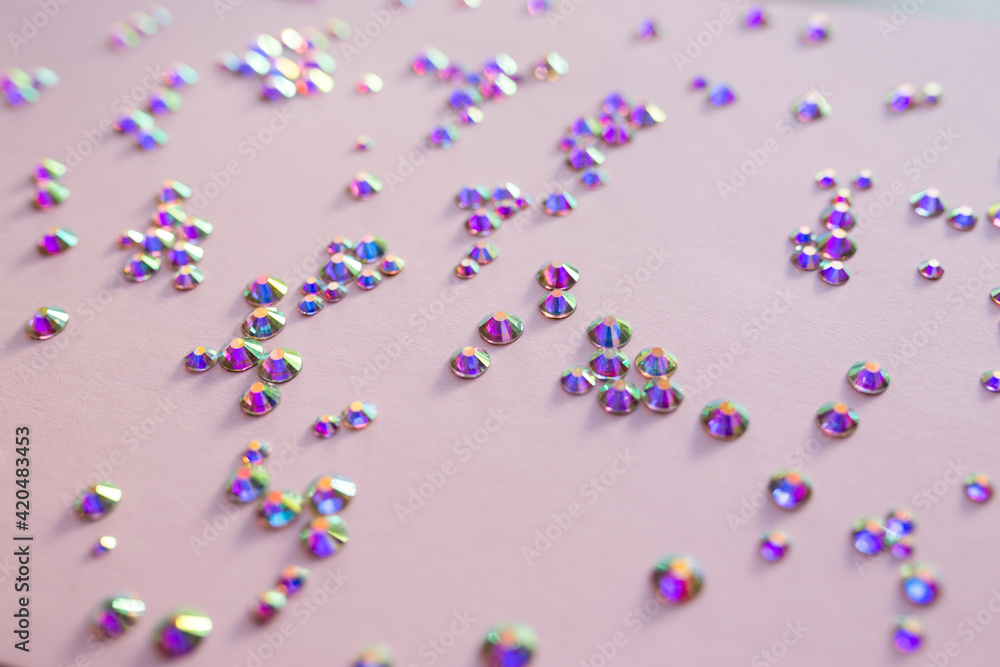 Fototapeta premium rhinestones on a pink background, blure. design for text