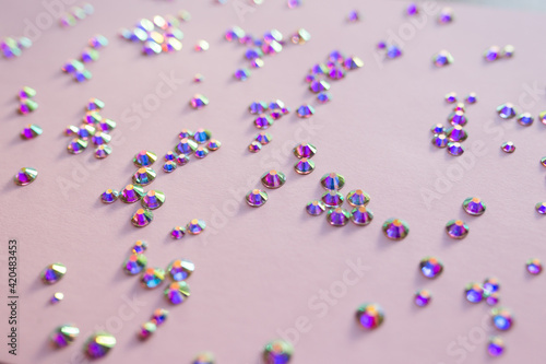 rhinestones on a pink background, blure. design for text photo