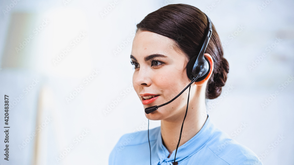 portrait of smiling call center operator in headset portrait of smiling call center operator in headset