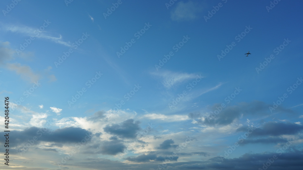 The beautiful sunset sky view with the colorful clouds and blue background The beautiful sunset sky view with the colorful clouds and blue background