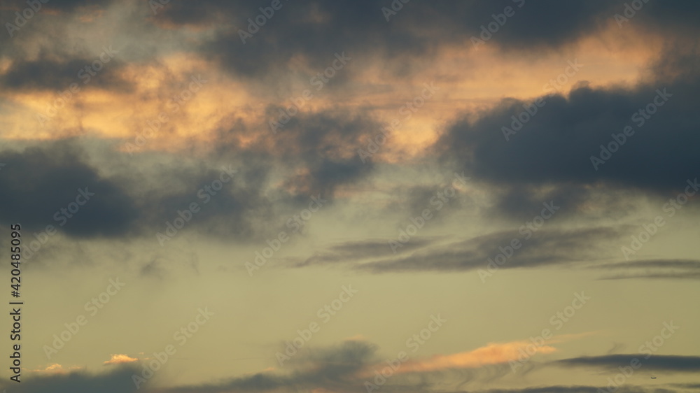 The beautiful sunset sky view with the colorful clouds and blue background
