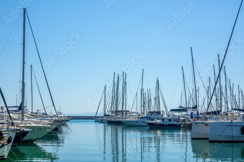 Plenty of Sailing Yachts in the Boat Parking Lot on a Sunny Summer Day © goodman_ekim