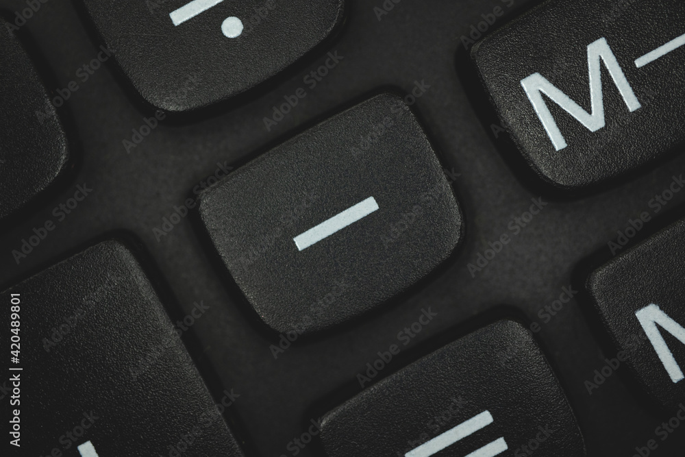Minus sign and symbol, calculator keyboard button close-up Minus sign and symbol, calculator keyboard button close-up