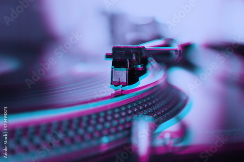 Fotografie Retro dj turntable playing vinyl record with music