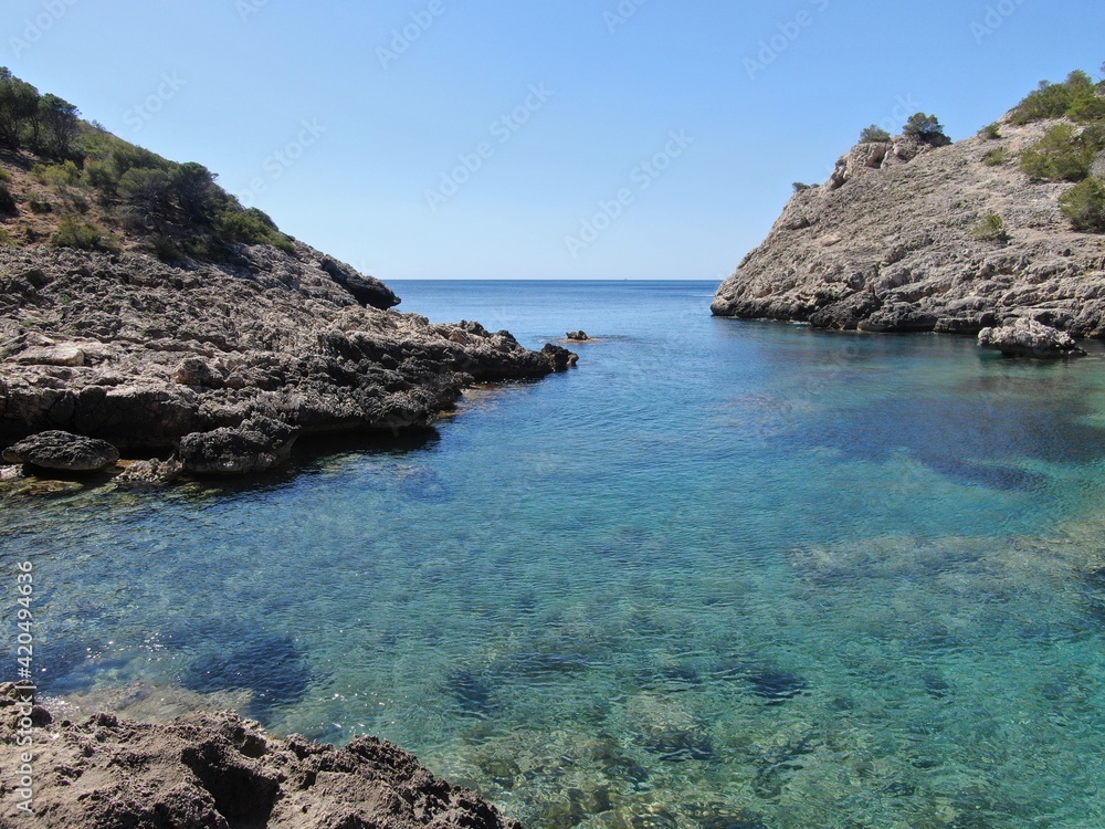 seacoast of mallorca with beaturiful view of the sea with crystalclear water. Sea view of turquoise colour. Concept of summer, travel, relax and enjoy seacoast of mallorca with beaturiful view of the sea with crystalclear water. Sea view of turquoise colour. Concept of summer, travel, relax and enjoy