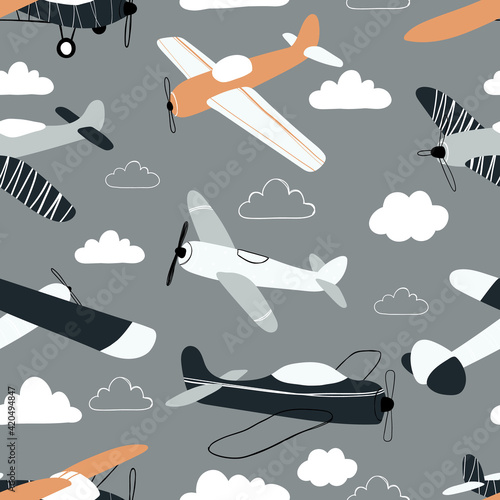 Vector hand-drawn seamless repeating children simple pattern with aircraft and clouds in Scandinavian style on a gray background.Kids seamless pattern with planes. Funny airplanes.