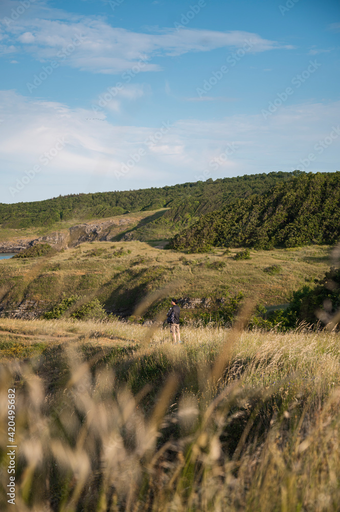 Man standing against beautiful landscape Man standing against beautiful landscape