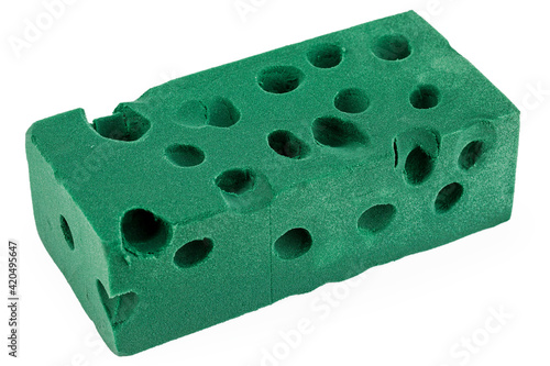 A green floral foam brick is used, insulated on a white background. Floral Sponge.