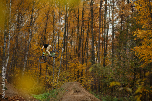 Extreme dirt jump rider on bicycle photo