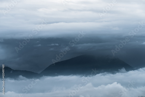 The mountain range in the early morning clouds