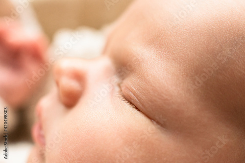 Russia 2019. Face of newborn baby, maternal care, love and family hugs, tenderness, macro shoot