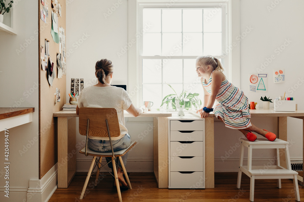Mom Working From Home with Daughter Mom Working From Home with Daughter